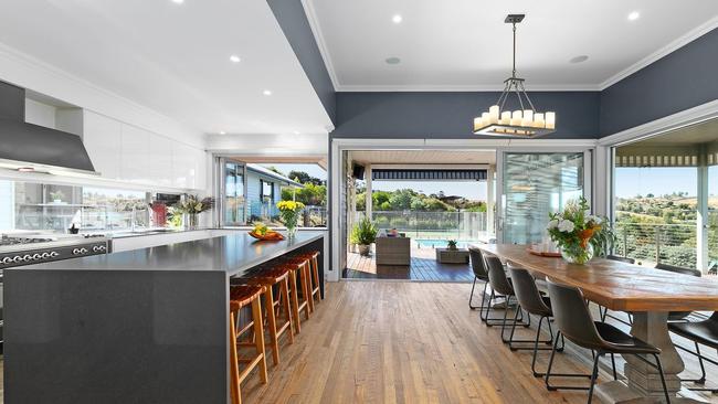 A huge kitchen and living area is seamlessly connected to the outdoor zones.