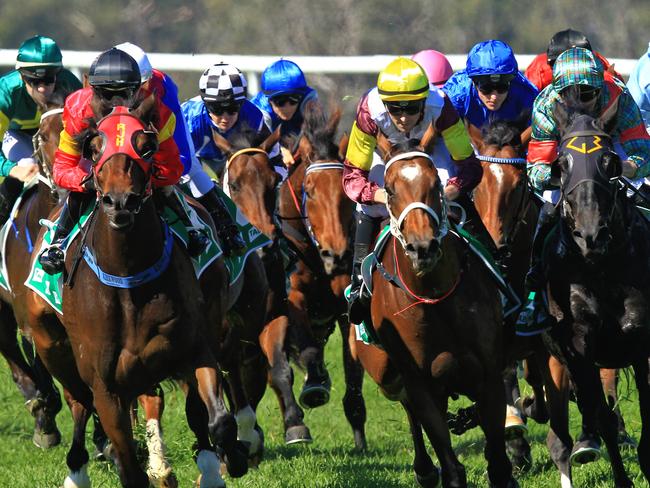 Loving home ridden by Tye Angland  (yellow cap, maroon with yellow armbands) wins race 1 during Scone  Races located in the Upper Hunter Region of NSW. The Bend . Pic Jenny Evans