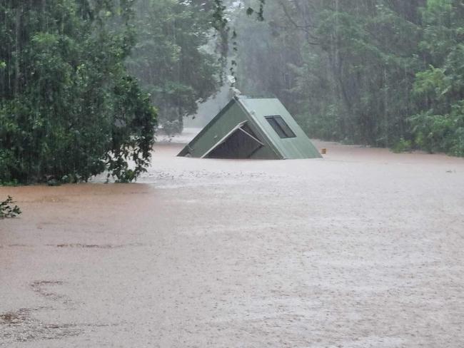 The toll booth at the Daintree ferry washes away. Picture: Charmaine Norris