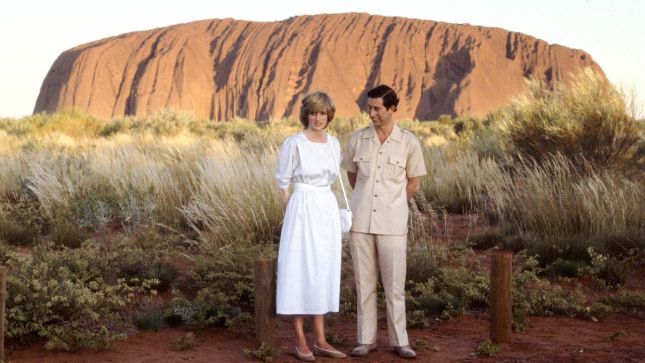 Prince Charles and Diana, Princess Of Wales standing in front of Ayers Rock.