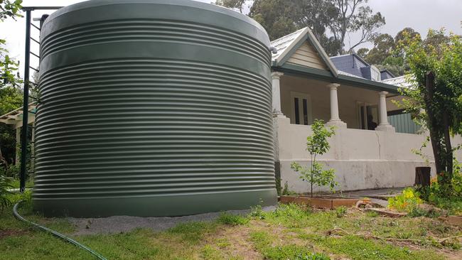 The rainwater tank next to Branko Soda’s house at Magill. Picture: Colin James