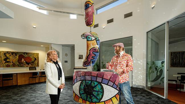 A $50 million regional art gallery can be profitable according to a Nillumbik Council feasibility study. Mayor Karen Egan and local artist Matt Blackwood study just one example of some of the artworks currently kept at the council’s offices.