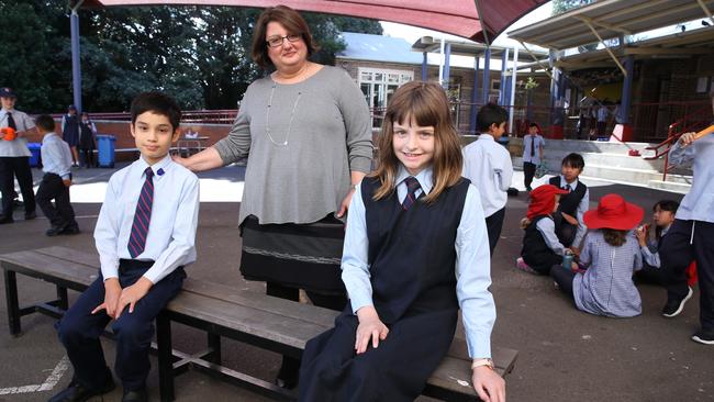 Caroline Boulis, principal of St Pius Primary School In Enmore in Sydney's inner west, with year 5 vice-captains Jagger Cosgrove and Daisy White. Picture: Britta Campion