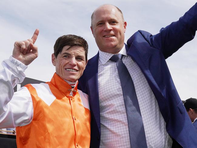 Jockey Craig Williams and trainer Danny OBrien pose with the trophy after winning with Vow And Declare to victory in race 7, the Lexus Melbourne Cup, during Melbourne Cup the Lexus Melbourne Day, at Flemington Racecourse in Melbourne, Tuesday, November 5, 2019. (AAP Image/Michael Dodge) NO ARCHIVING, EDITORIAL USE ONLY