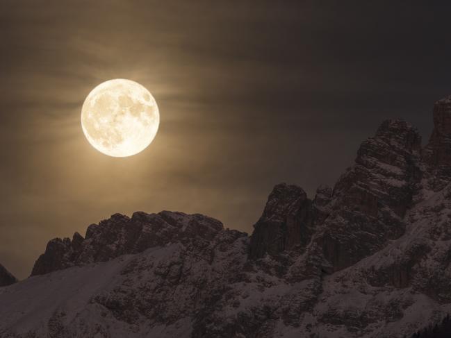 Insight Astronomy Photographer of the Year 2017 shortlist selection: Super Moon . Picture: Giorgia Hofer (Italy) The magnificent sight of the Super Moon illuminating the night sky as it sets behind the Marmarole, in the heart of the Dolomites in Italy. On the night of 14 November 2016, the Moon was at perigee at 356.511 km away from the centre of Earth, the closest occurrence since 1948. It will not be closer again until 2034. On this night, the Moon was 30% brighter and 14% bigger than other full moons. Laggio di Cadore, Province of Belluno, Italy, 15 November 2016