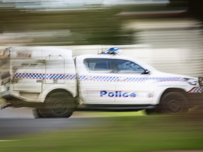 A police vehicle under lights and sirens on Ruthven St in Toowoomba, Wednesday, April 24, 2024. generic Queensland Police, QPS, police Picture: Kevin Farmer