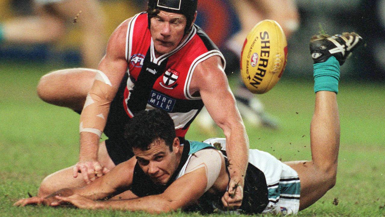 Footballer Shane Bond (bottom) with Nathan Burke.