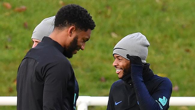 England's defender Joe Gomez, left, and midfielder Raheem Sterling attend an training session at St George's Park Picture: AFP