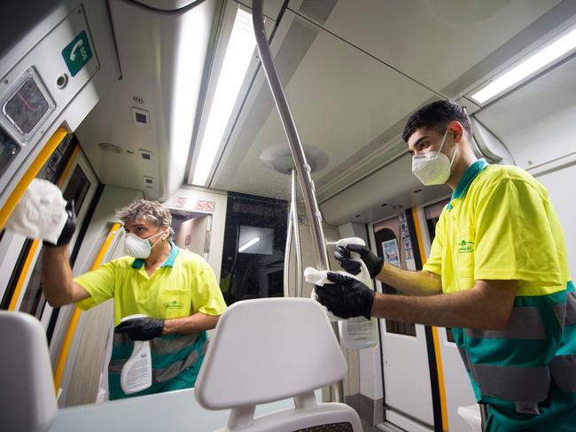 Employees carry out a disinfection of a train of the Basque railway company Euskotren in the Spanish Basque city of Irun. Picture: AFP