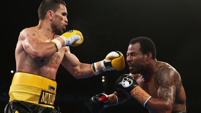 Anthony Mundine lands a left on Shane Mosley in 2013.