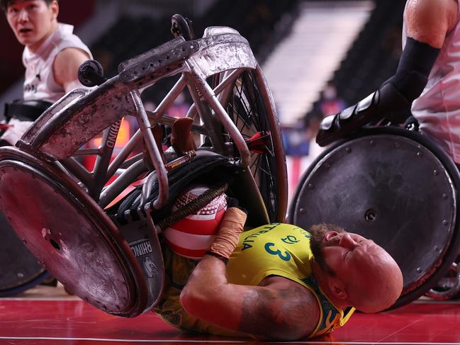 Ryley Batt, of Team Australia scores a try against Yukinobu Ike, of Team Japan during the bronze medal wheelchair rugby match on day 5 of the Tokyo 2020 Paralympic Games. Picture: Alex Pantling/Getty Images