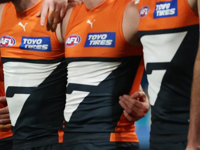 SYDNEY, AUSTRALIA - SEPTEMBER 14:  The Giants line up for the welcome to country and national anthem ceremony during the AFL First Semi Final match between GWS Giants and Brisbane Lions at ENGIE Stadium, on September 14, 2024, in Sydney, Australia. (Photo by Matt King/AFL Photos/via Getty Images)