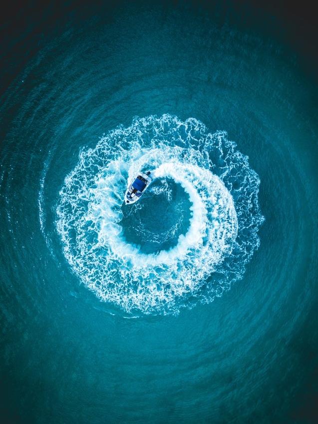 A boat circles in Jervis Bay, New South Wales, Australia. Picture: @Ahmedwehbe_ / Supplied