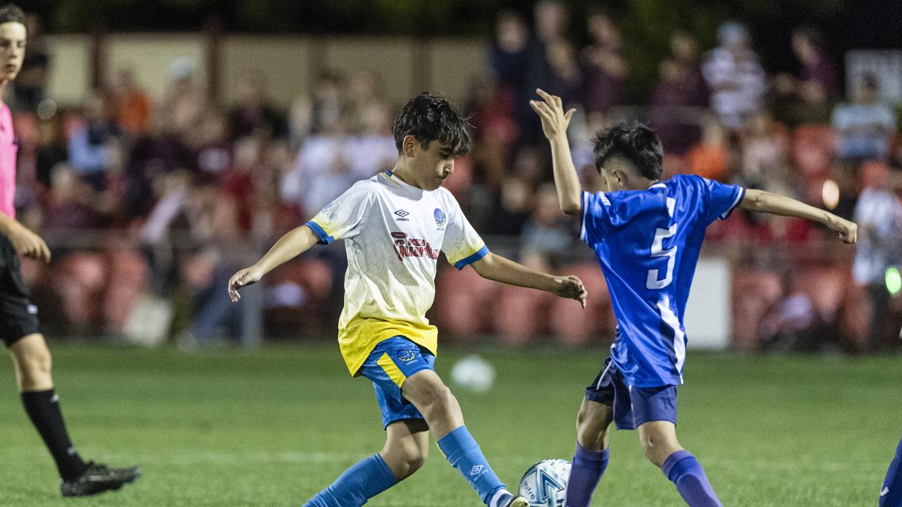 Alhassan Hussen of USQ FC (left) against Samr Qaeerani of Rockville Rovers White in Football Queensland Darling Downs Community Juniors U13 Div 1 Maroon grand final at Clive Berghofer Stadium, Friday, August 30, 2024. Picture: Kevin Farmer