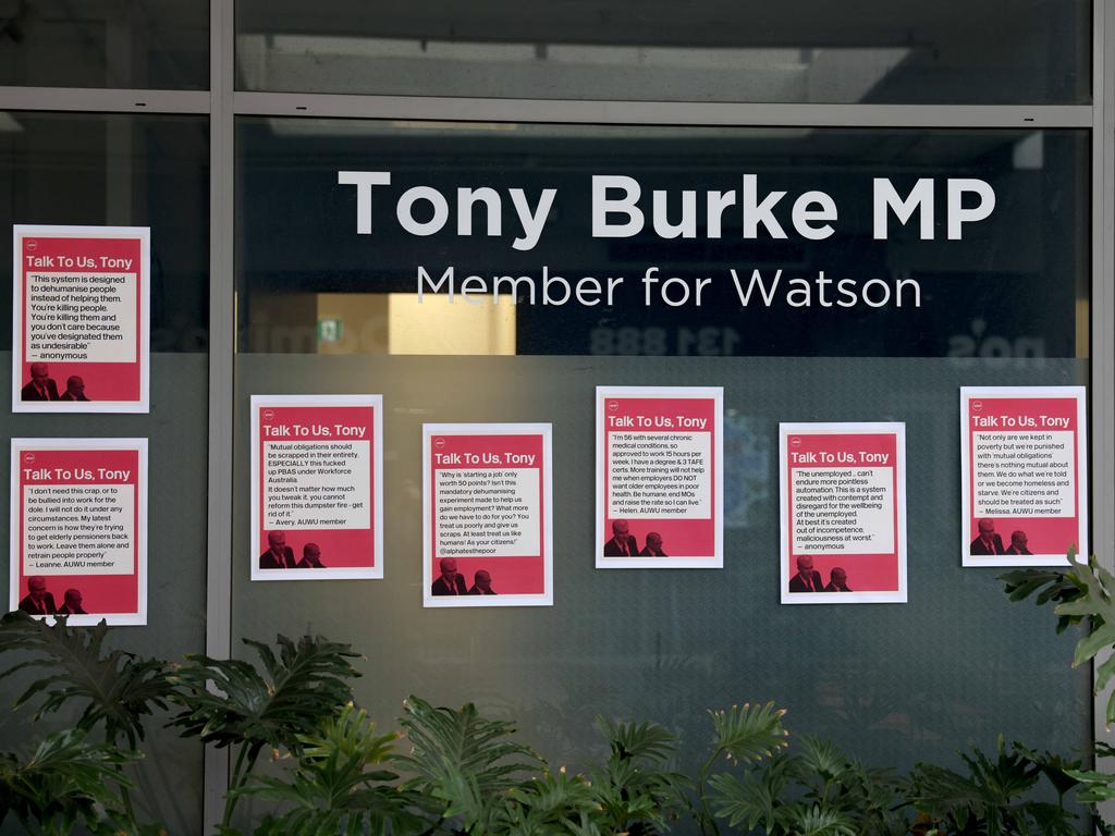 Protesters left Mr Burke’s office covered in posters bearing the slogan ‘Talk to us, Tony’. Picture: NCA NewsWire / Damian Shaw