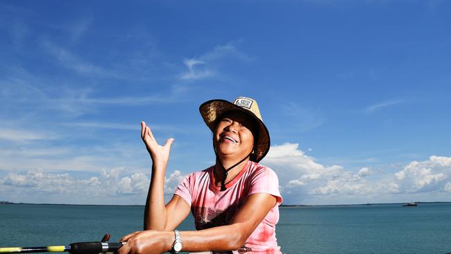 Maria Alberto, from Virginia, fishing at Stokes Hill Wharf before an afternoon storm rolls in. Picture: Katrina Bridgeford