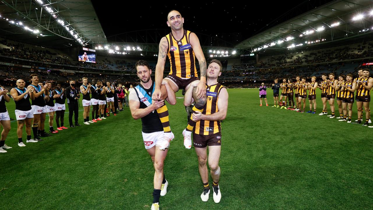 Shaun Burgoyne was carried off the field by Liam Shiels and Travis Boak in his 400th game (Photo by Michael Willson/AFL Photos via Getty Images)