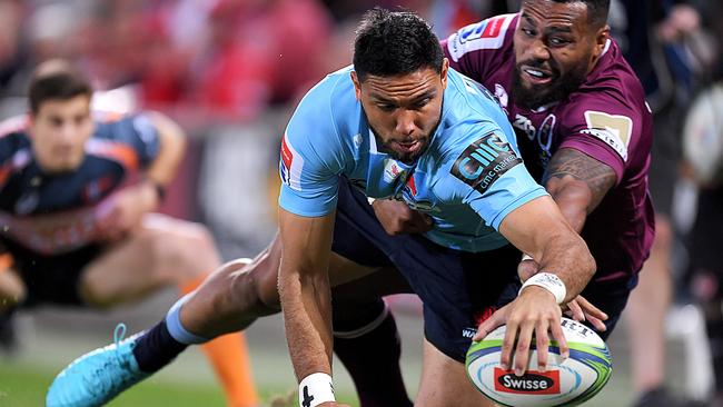 Curtis Rona reaches out to score for the Waratahs against the Reds last year. Picture: Getty Images