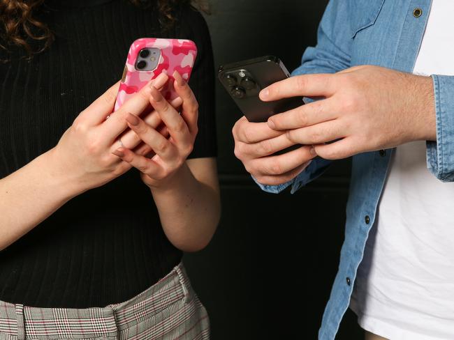 SYDNEY, AUSTRALIA : Newswire Photos AUGUST 28 2023: Patrick Blacker and Aaliyah Johnston, both 20, in Sydney with their phones. A case study on Gen Z and their phone use and why they prefer to text rather than speak on the phone. Picture: NCA Newswire/ Gaye Gerard