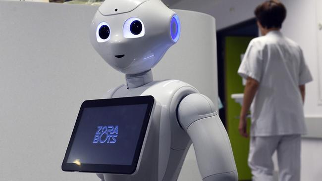 Would you nick less if yours self serve checkout looked more like Pepper the robot helper? Picture: AFP PHOTO / JOHN THYS