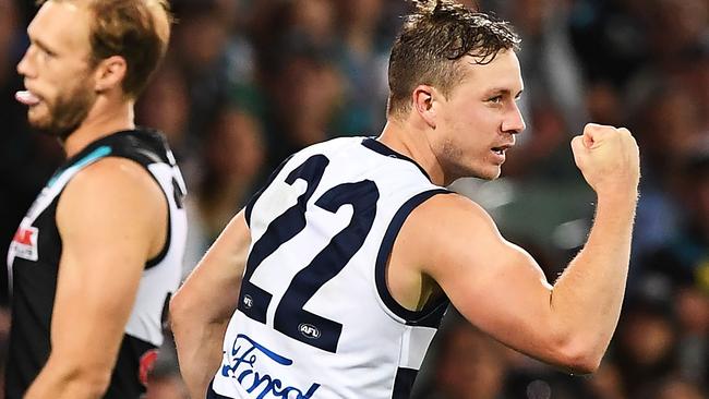 Mitch Duncan celebrates a goal during the Cats’ win over the Power. Picture: Getty