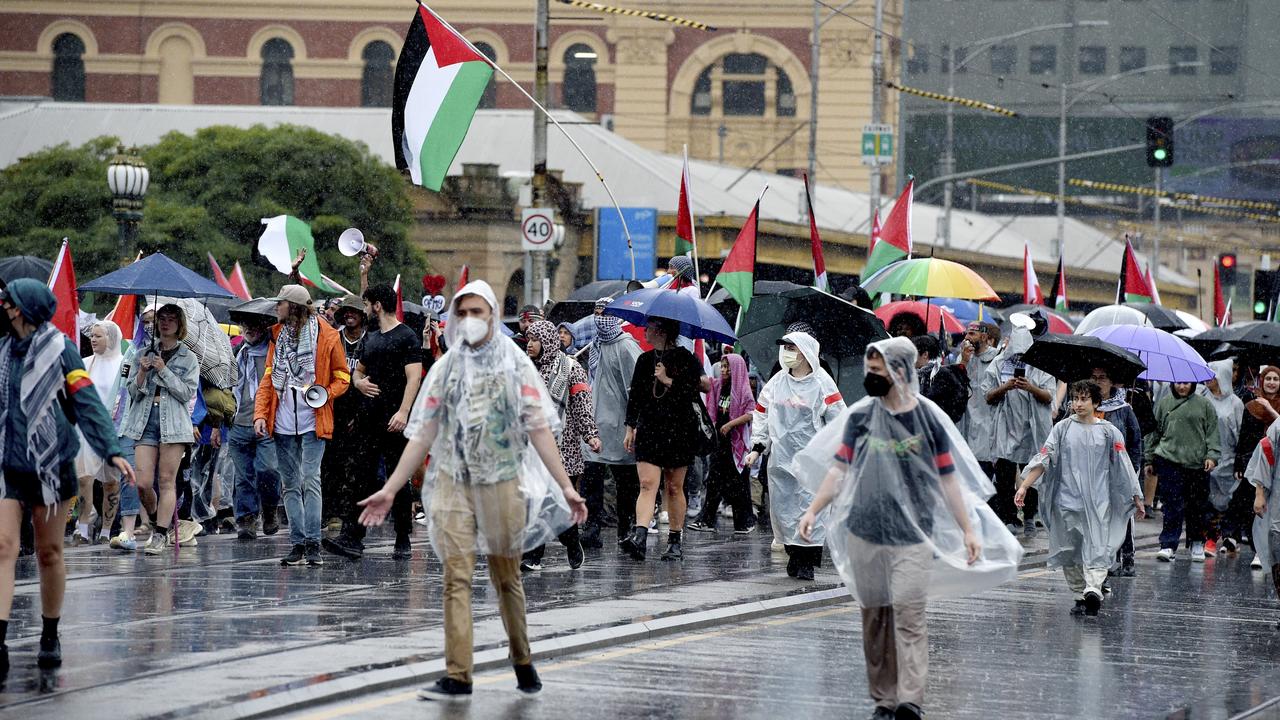 Despite the downpour, protesters flocked to Melbourne’s CBD in droves. Picture: NCA NewsWire/ Andrew Henshaw