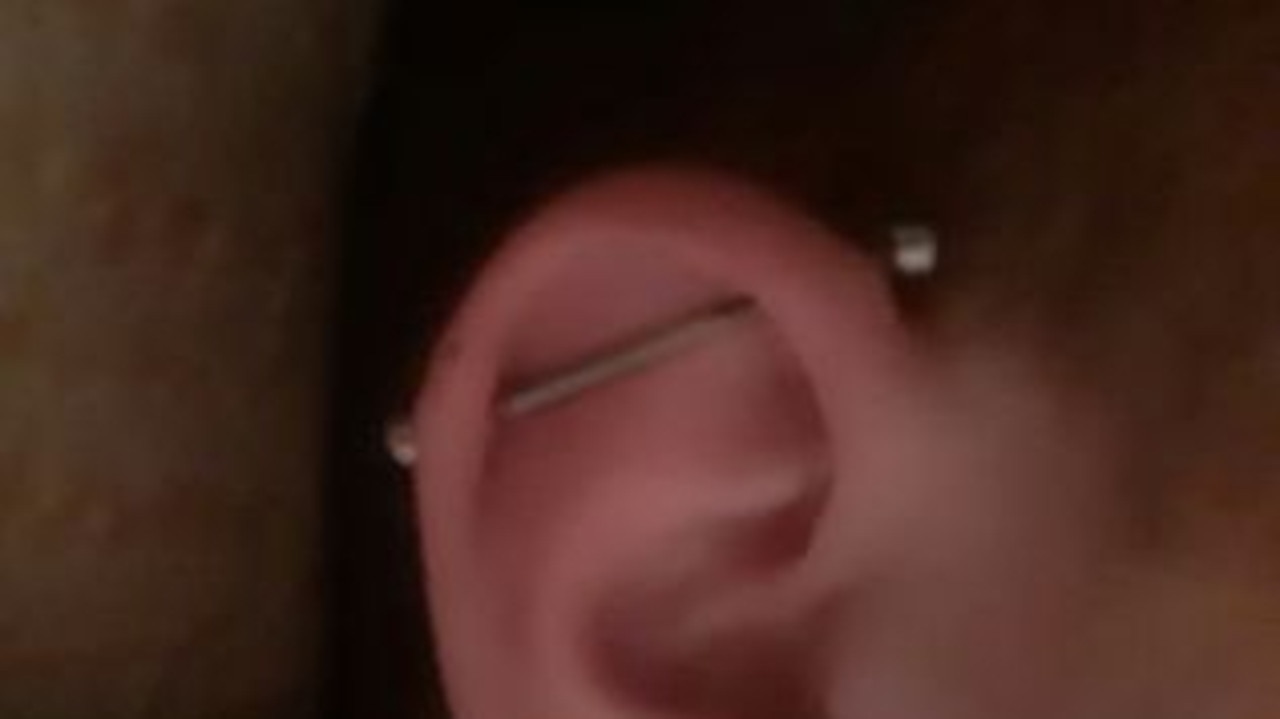 Logan Eland's industrial ear piercing.