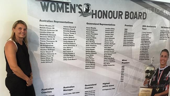 Karyn Murphy next to the women's honour board which was unveiled at Souths Logan's clubhouse, West End, on Saturday.