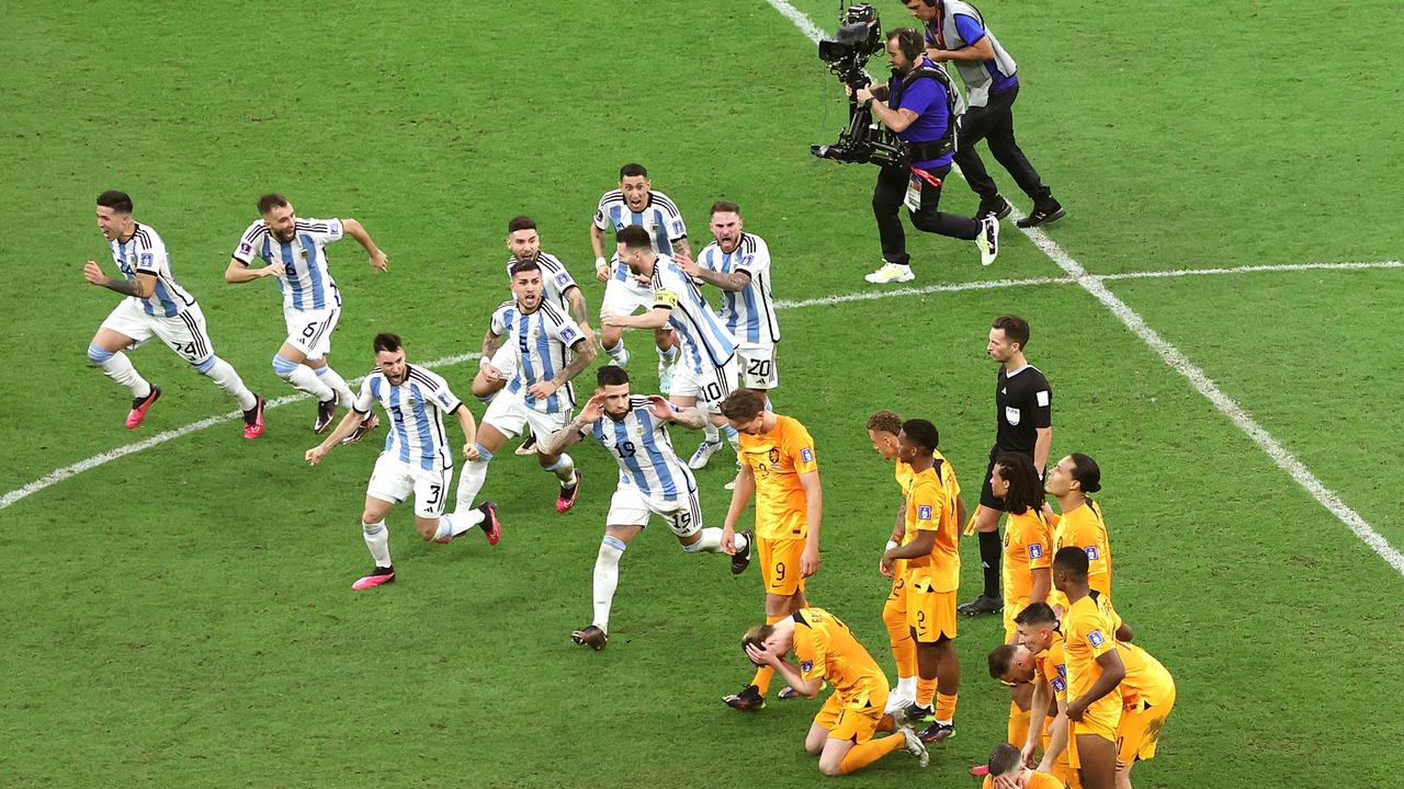 Argentina players rub it in the face of the Netherlands team. Photo by Elsa/Getty Images.