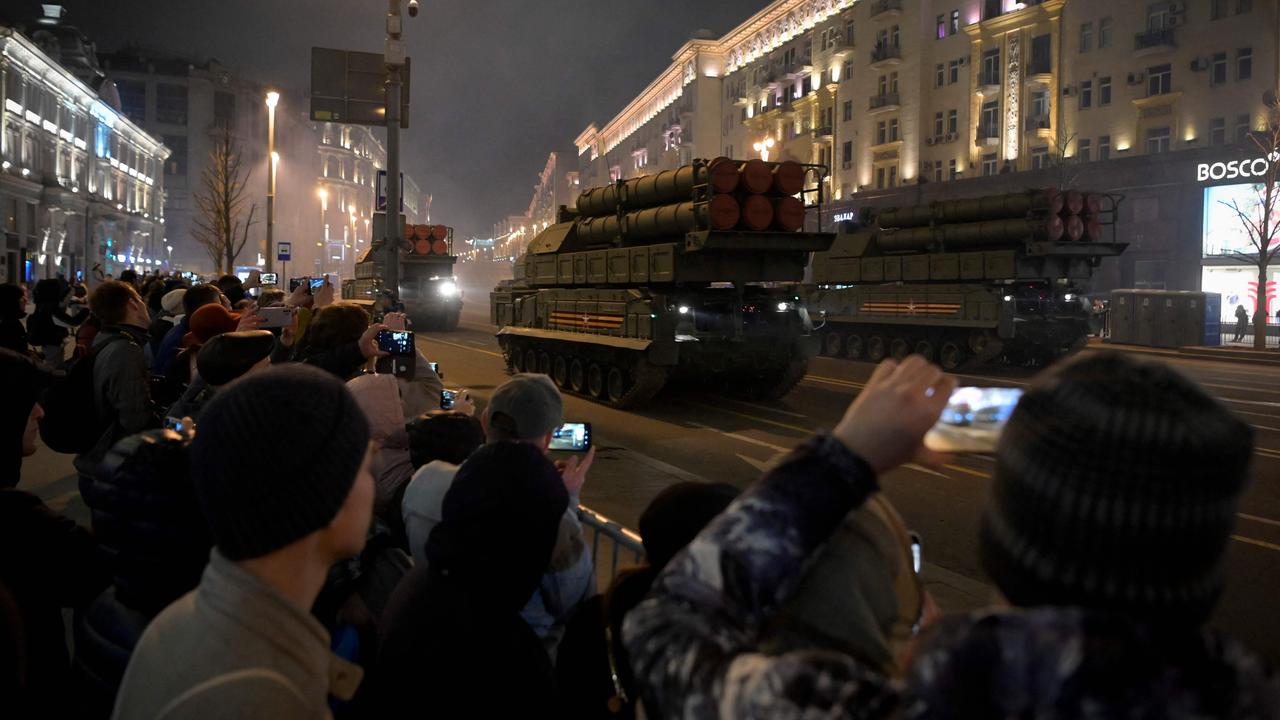 Eager Russians took selfies with the military vehicles and troops. Picture: Natalia Kolesnikova / AFP