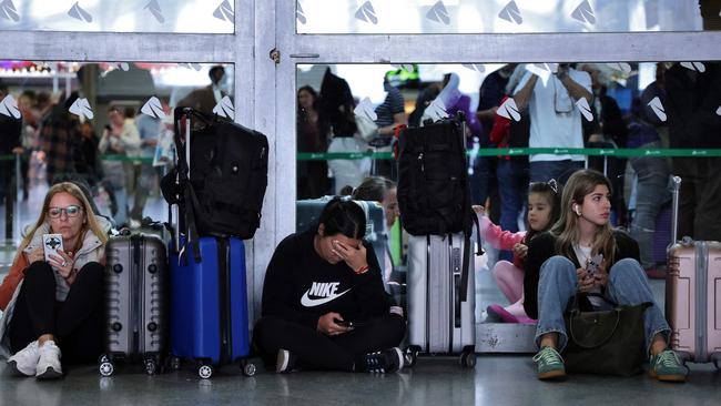 Passengers wait for their trains at Atocha station in Madrid on April 29, 2025, the day after a massive power cut affecting the entire Iberian Peninsula and south of France. (Photo by Thomas COEX / AFP)
