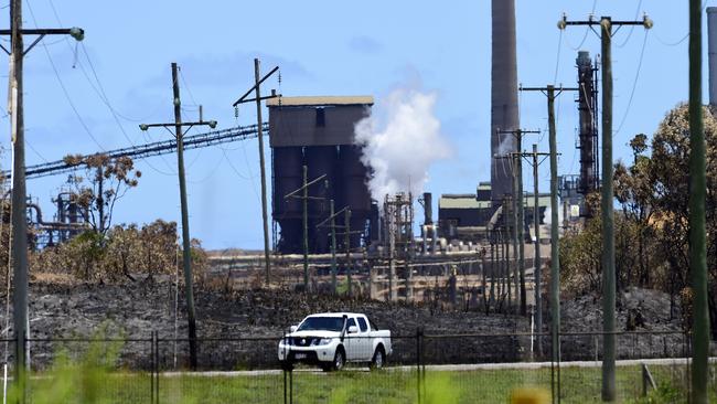 Workers leave the Queensland Nickel refinery in Townsville after being told they no longer had jobs.