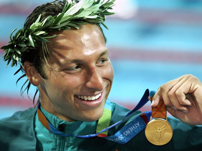 Ian Thorpe of Australia smiles with his gold medal after winning the Mens 200 Freestyle Final at the Olympic Aquatic Centre during the 2004 Olympic Games in Athens, Greece 16/08/2004.