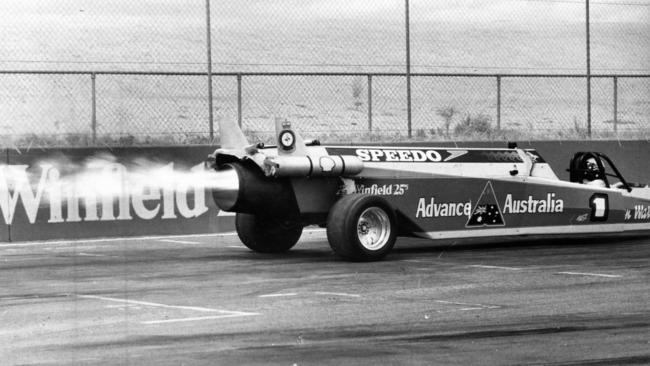 Flames shoot from the jet engine as Ken Warby roars down the drag strip in a practice run at the Adelaide International Raceway, Virginia, in 1981.