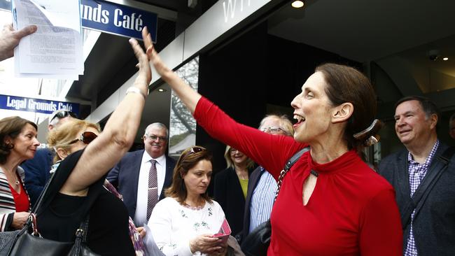 Save our Councils president Carolyn Coorigan celebrates with a supporter after the victory by Mosman and North Sydney councils at the Land and Enviroment Court. Picture: John Appleyard