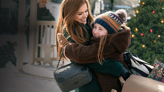 Isla Fisher as Mackenzie and Willa Skye as Mia in a scene from Godmothered.