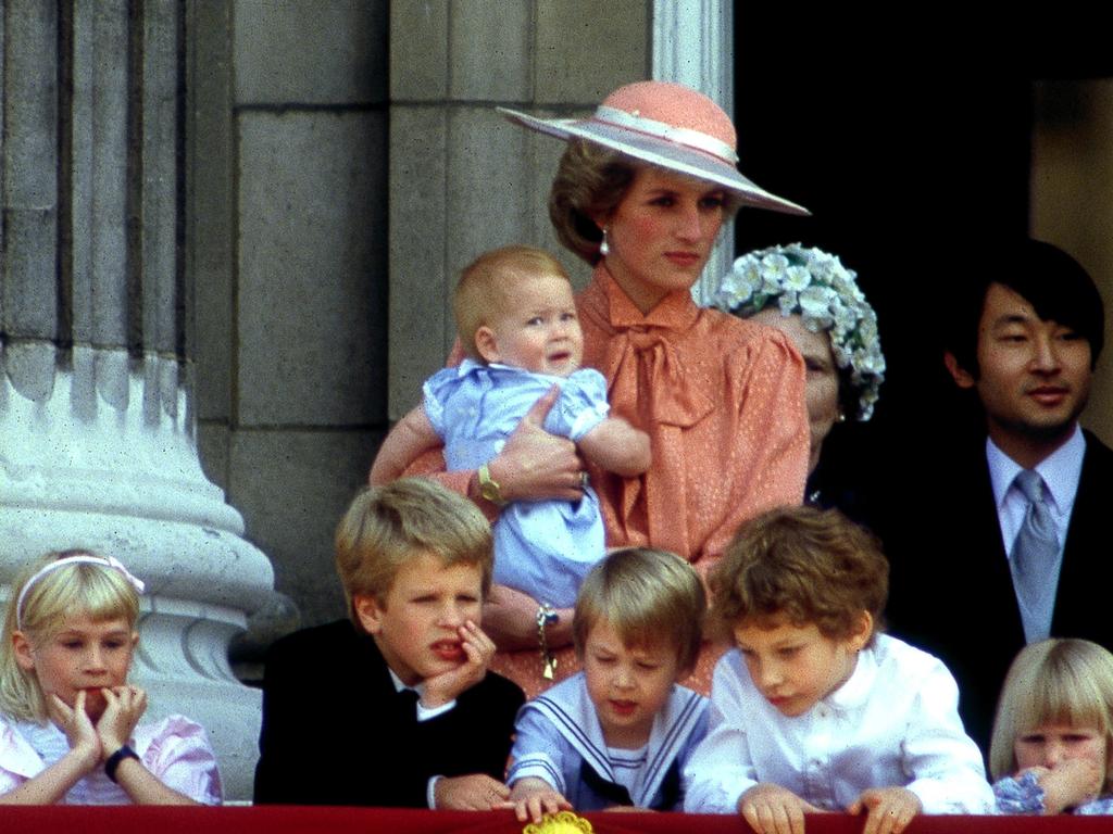 A tiny Prince Harry appeared in his mum’s arms.