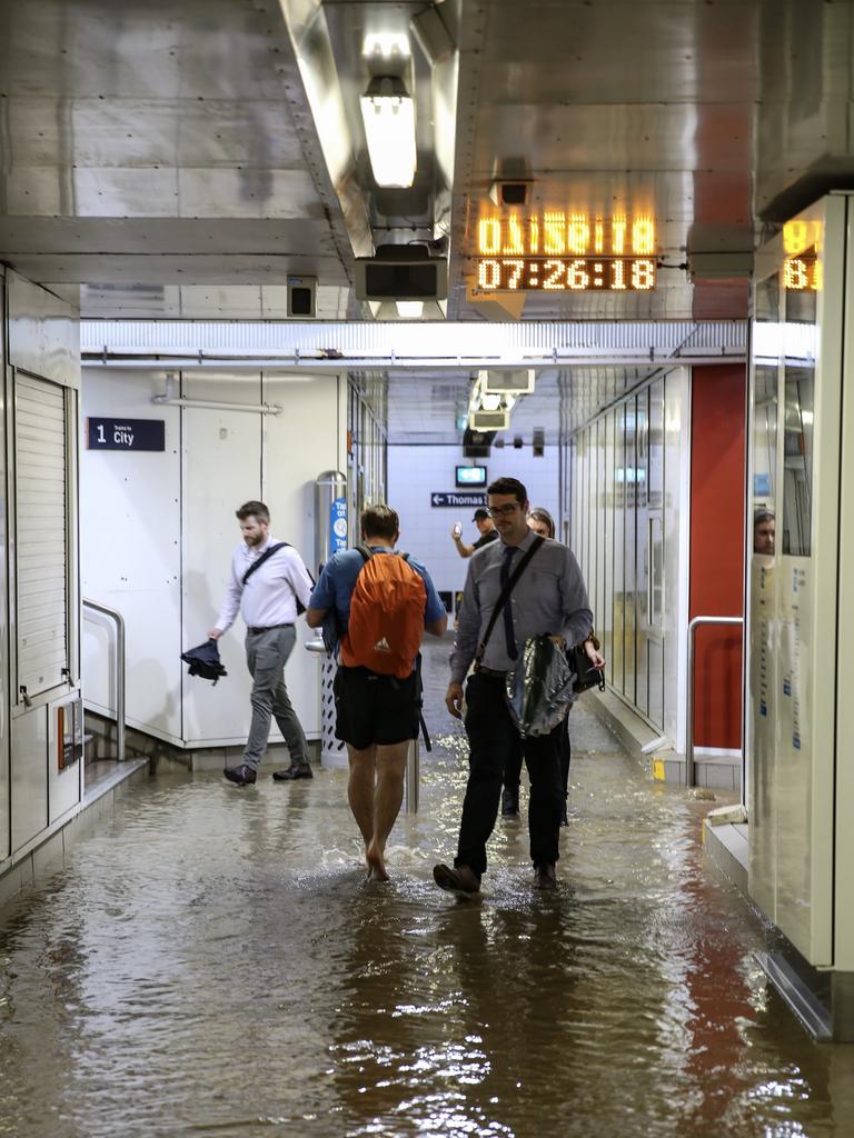 Commuters struggle against torrential rain and gale force winds in Lewisham as Sydney is lashed with a monumental early summer storm, 28/11/18. Picture: Nicholas Eagar