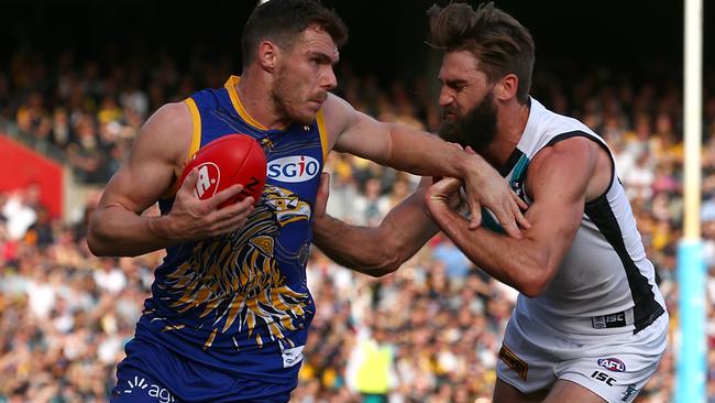 Justin Westhoff pays close attention to the Eagles’s Luke Shuey. Picture: Paul Kane (Getty Images)