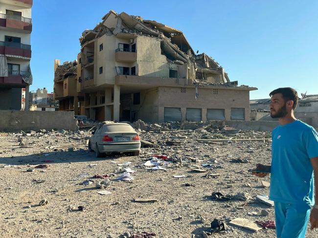 A man walks past destruction caused by Israeli airstrikes in the Masaken neighbourhood on the outskirts of Tyre. Picture: AFP