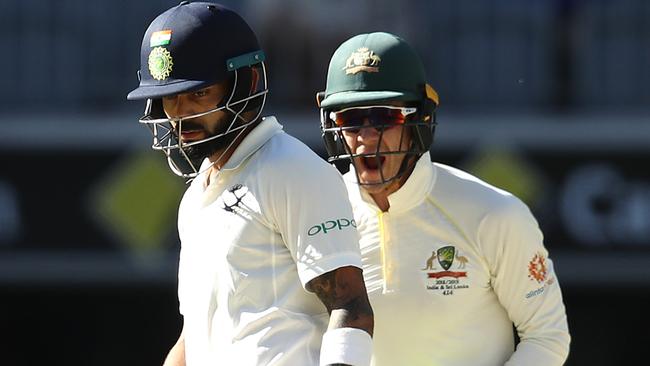 Tim Paine celebrates as Virat Kohli walks after being dismissed on day four. Picture: Getty Images