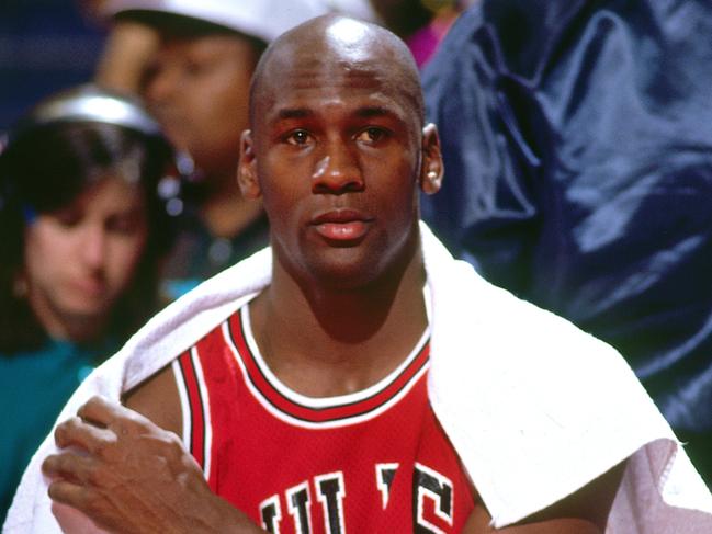 LANDOVER - 1991: Michael Jordan #23 of the Chicago Bulls looks on from the bench during a 1991 season game against the Washington Capitals at the Capital  Centre in Landover, Maryland.   (Photo by Jerry Wachter/Sports Imagery/Getty Images)