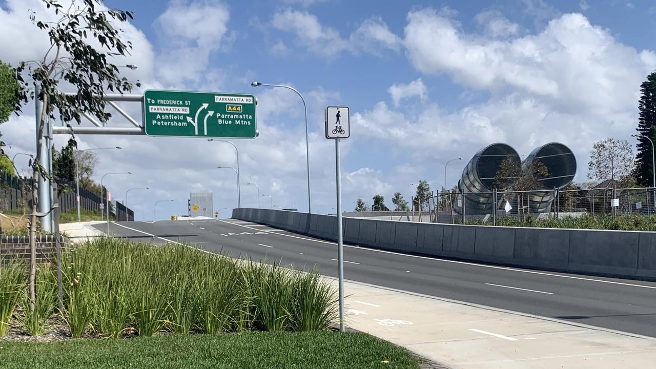 There is only a short distance between a set of lights, a road sign, a slip road and where the road splits here in Haberfield. Picture: Benedict Brook