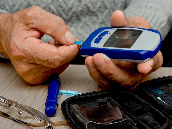 Concept diabetes in the elderly retired. Senior man with glucometer checking blood sugar level at home. Learn to use a glucometer  - Picture iStock