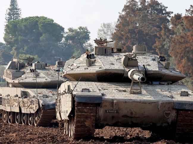 Israeli battle tanks are deployed at a position along the border with the Gaza Strip and southern Israel. Picture: AFP