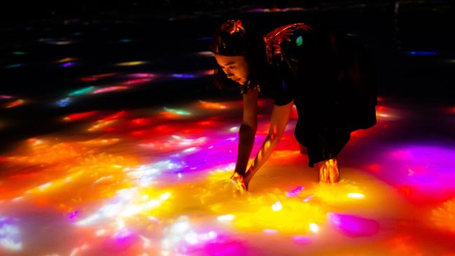 TeamLab Planets and its interactive art which involves going into a darkened room full of warm water.