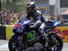 Spain's rider Jorge Lorenzo celebrates on his Movistar Yamaha MOTOGP N°99 after coming in first in the MotoGP race of the French motorcycling Grand Prix on May 17, 2015 in Le Mans, western France. AFP PHOTO / CHARLY TRIBALLEAU