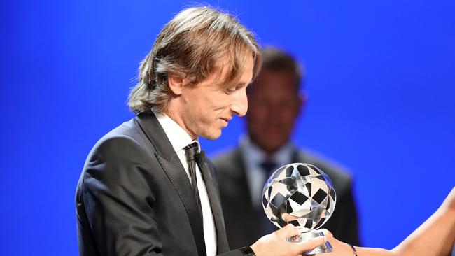 Real Madrid Croatia's midfielder Luka Modric receives the UEFA player of the season award