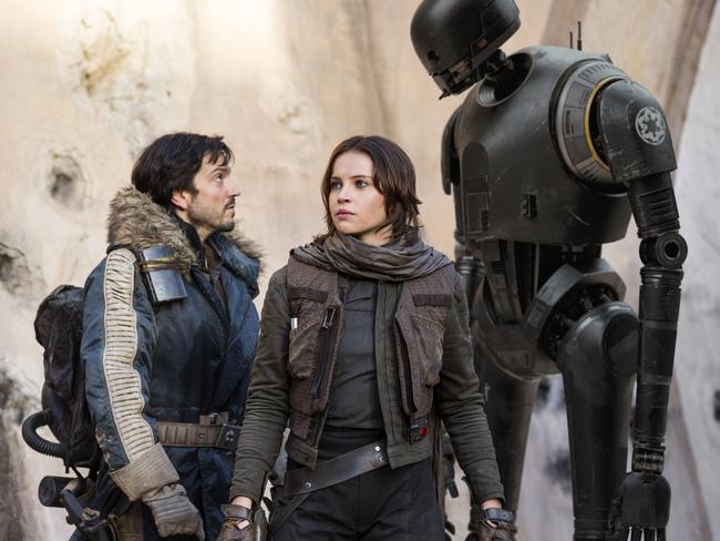 Scene from film Rogue One: A Star Wars StoryL to R: Cassian Andor (played by Diego Luna), Jyn Erso (Felicity Jones) and K-2SO (Alan Tudyk).Ph: Jonathan Olley. © 2016 Lucasfilm Ltd. All Rights Reserved.