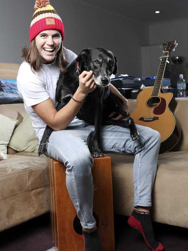 Crows AFLW co-captain Chelsea Randall with her dog Koda. She’s happy to be staying in Adelaide. Picture: Sarah Reed